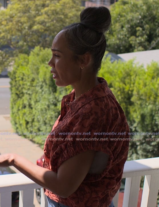 Tatiana's orange floral top on Reasonable Doubt